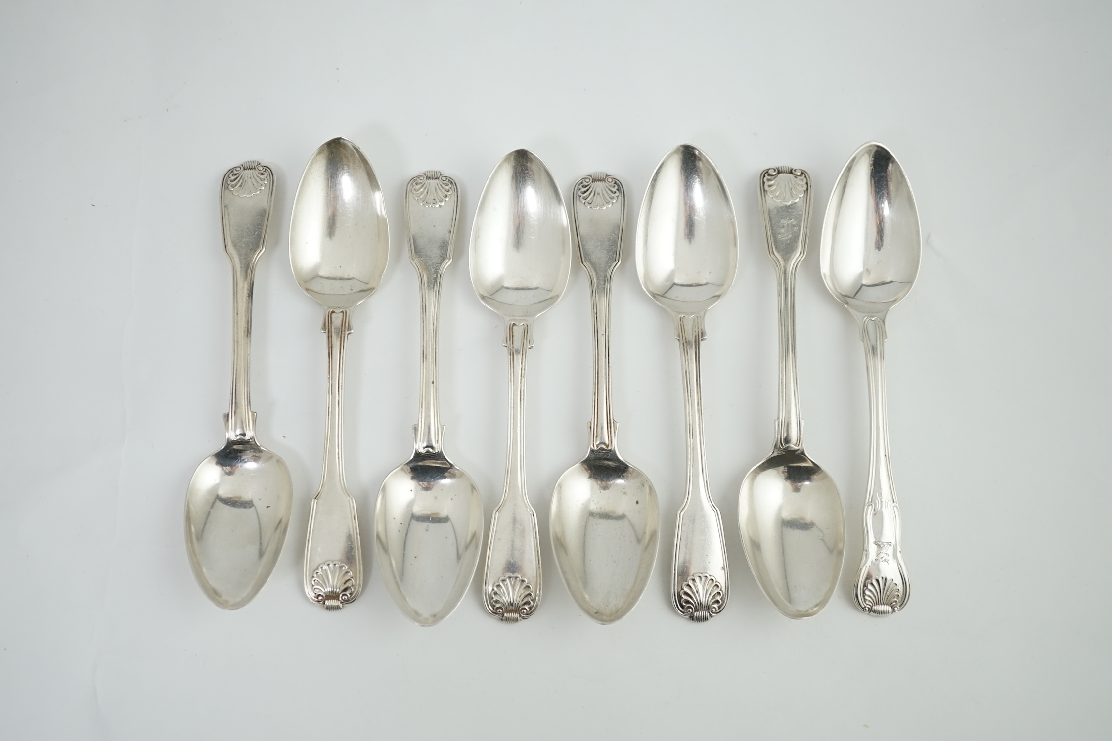 A set of seven George IV silver fiddle, thread and shell pattern dessert spoons, by Francis Higgins II, London, 1826 and another 1789